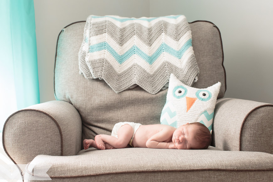 feather + light photography | main line, pa newborn lifestyle photographer | sleeping baby on chair | owl nursery