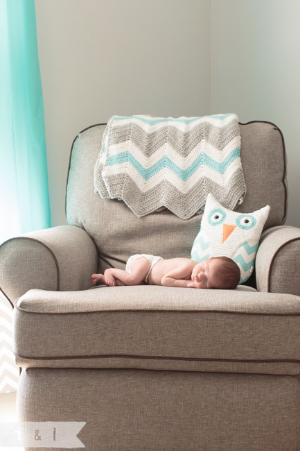 feather + light photography | main line, pa newborn lifestyle photographer | sleeping baby on chair | owl nursery