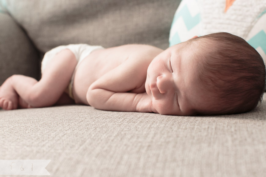 feather + light photography | main line, pa newborn lifestyle photographer | sleeping baby on chair | owl nursery