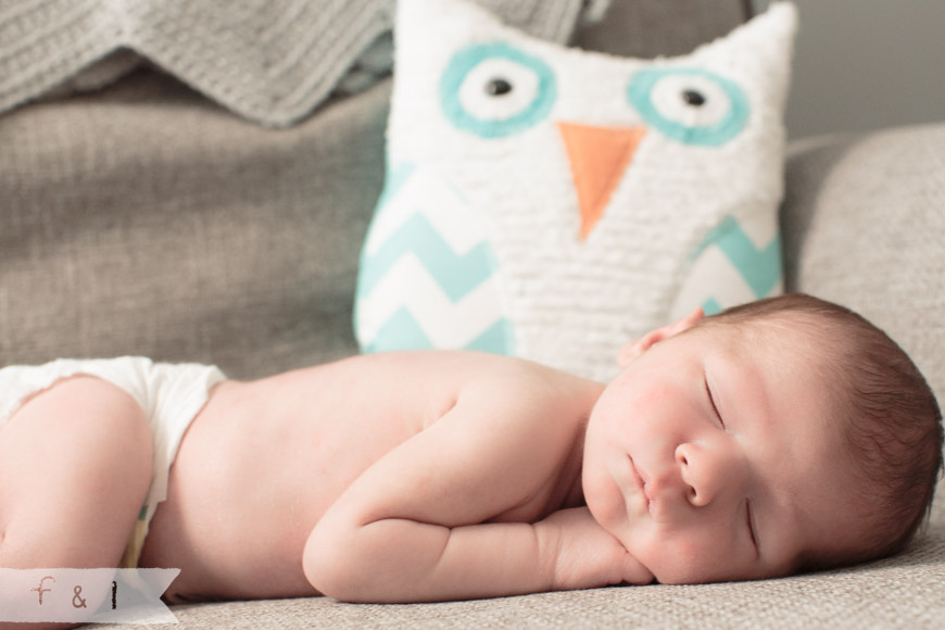 feather + light photography | main line, pa newborn lifestyle photographer | sleeping baby on chair | owl nursery