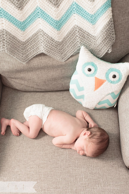 feather + light photography | main line, pa newborn lifestyle photographer | sleeping baby on chair | owl nursery