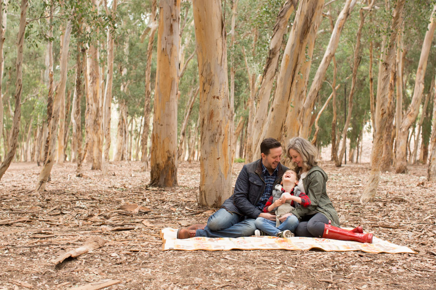 I absolutely love watching families and their littles grow! This is my third year taking the Smith Family photos and I have so enjoyed meeting up with them each and every single time. I also love the change of scenery. The first year we hit up Salt Creek, last year we strolled through downtown San Juan Capistrano, and this year we collected sticks in Serrano Creek Park. Here a just a few of my most favorites of this adorable family!